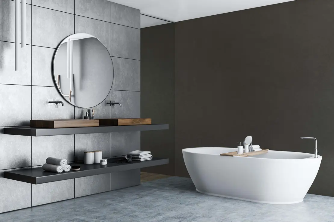 Baño con muros de microcemento de color gris profundo.